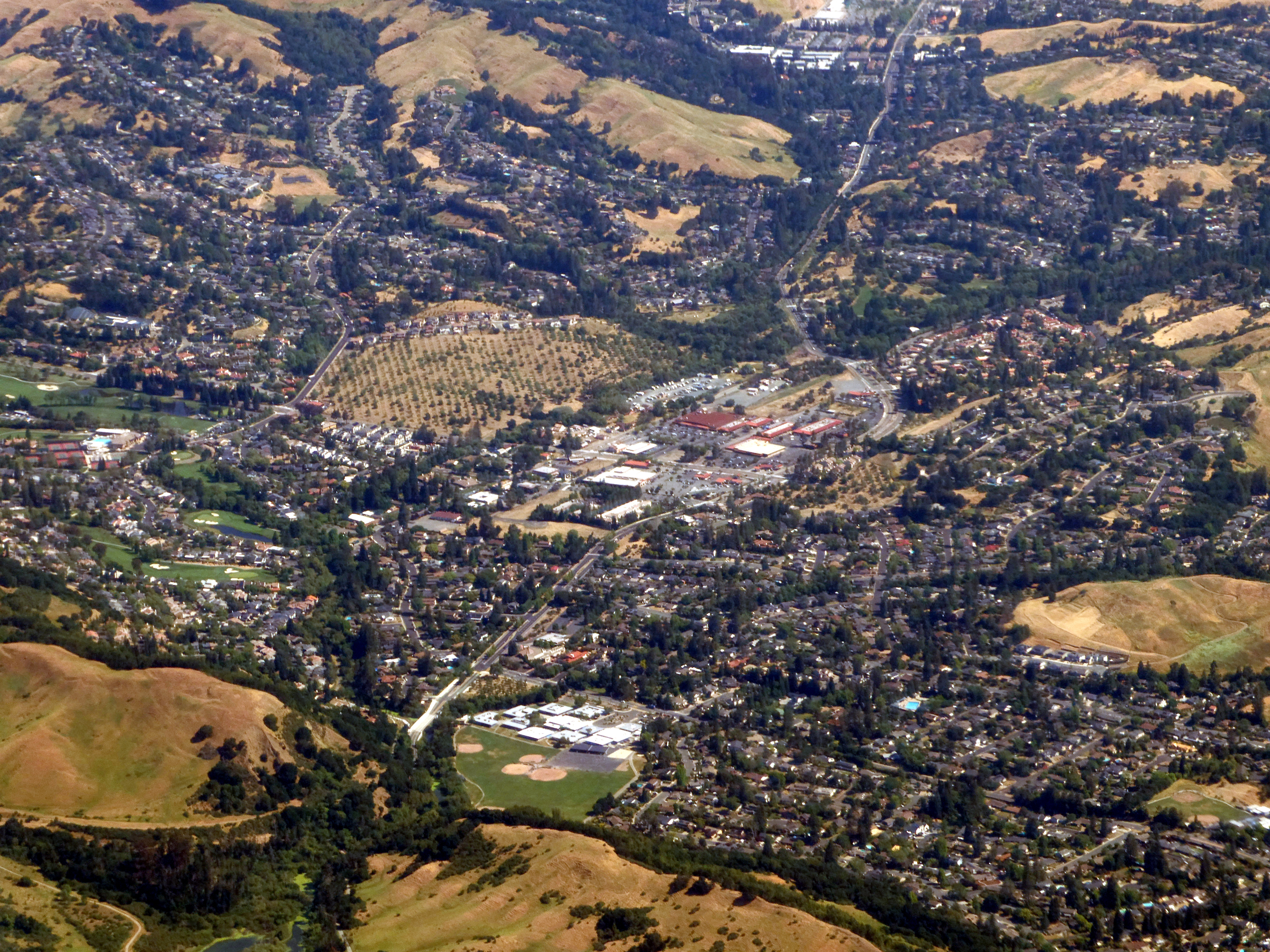 Moraga, California — an aerial view of residential neighborhoods nestled into the Lamorinda hills, showing the density of homes in this High Fire Hazard Severity Zone